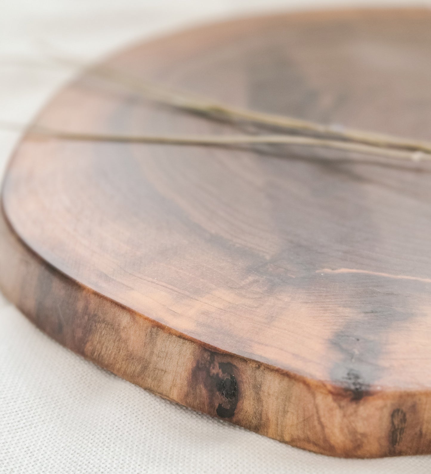 Wooden cutting board on a white surface