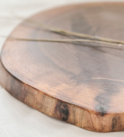 Wooden cutting board on a white surface