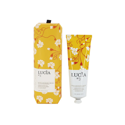 Lucia hand and body cream packaging with floral design on a white background